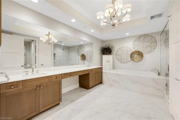 Ensuite primary bathroom offers plenty of room for two.