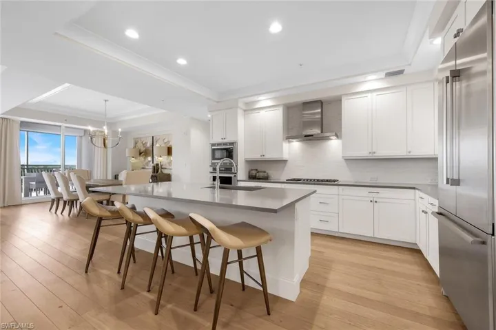 Spacious kitchen with ample cabinetry, beautiful backsplash, stainless appliances and gas stove.