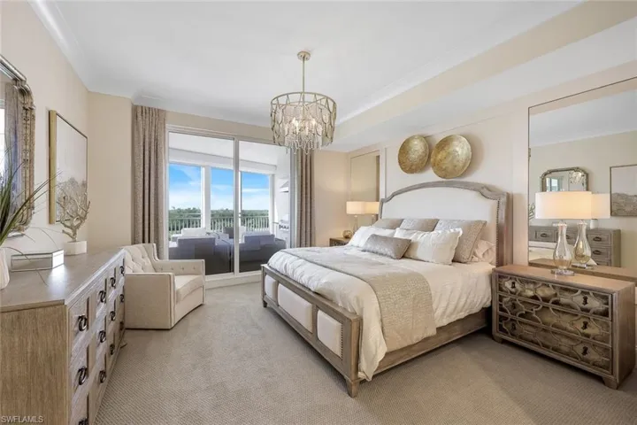 This spacious primary suite with lanai access will be your sanctuary after playing on the golf course or relaxing at the beach club.