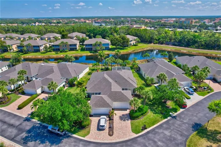 Aerial view with a water view and a residential view