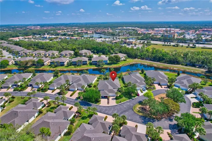 Aerial view with a residential view and a water view