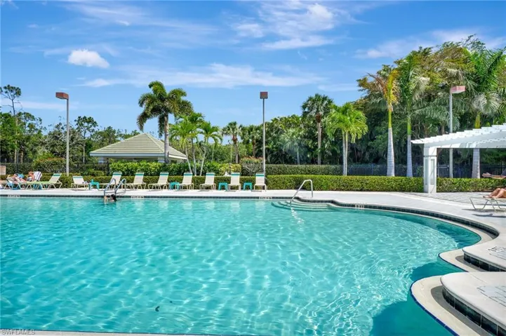Pool featuring a patio and a pergola