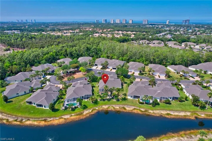 Drone / aerial view with a residential view and a water view