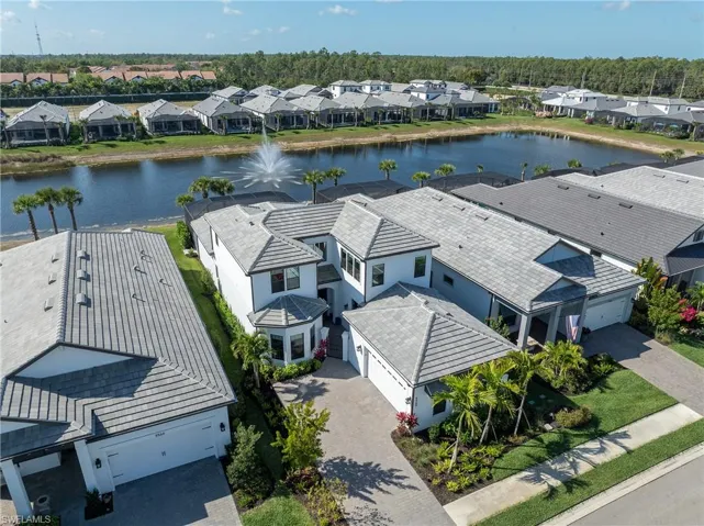 Aerial perspective of suburban area with a large body of water