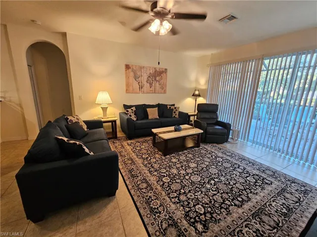 Tiled living room with ceiling fan