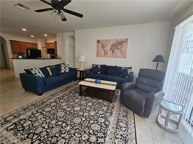 Tiled living room with ceiling fan
