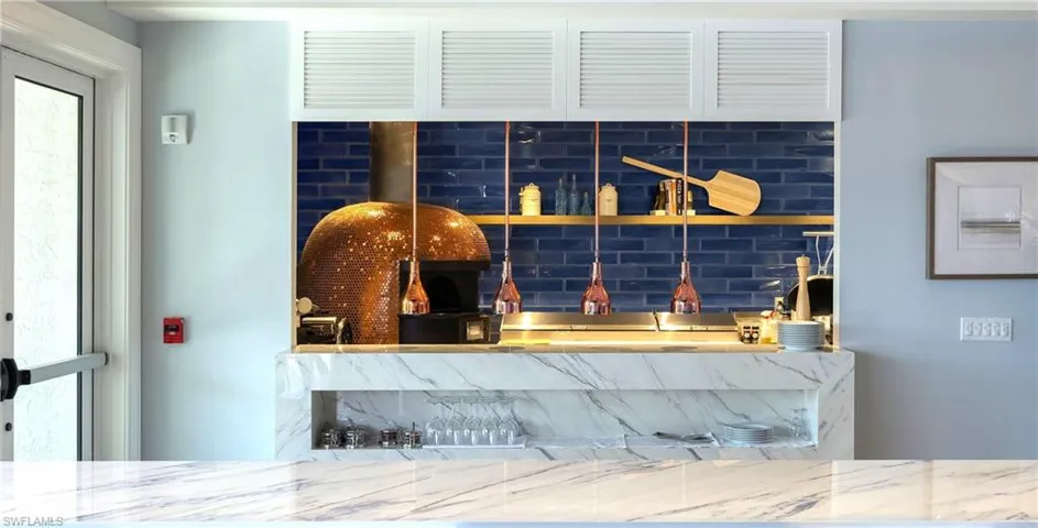 Detailed view of wet bar and a fire alarm