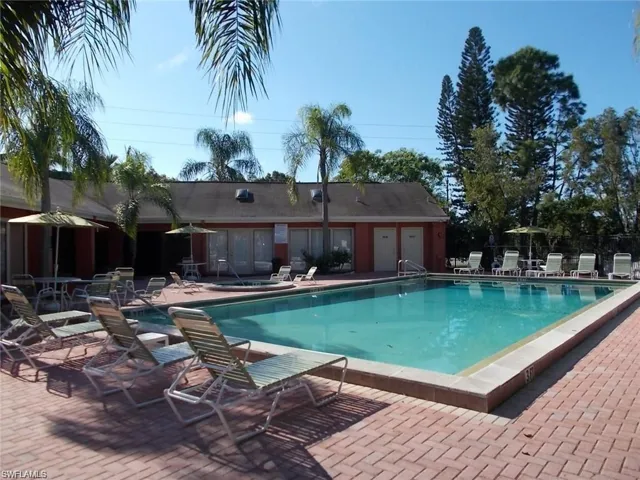 Community pool with a patio