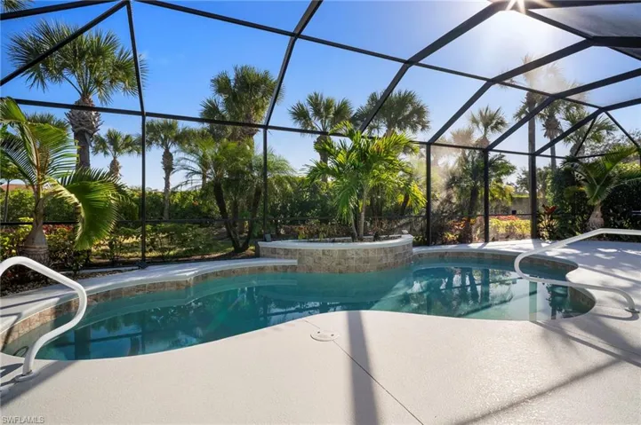 Outdoor pool with a lanai, a patio area, and a sunroom