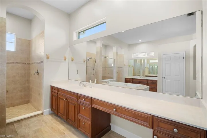 Bathroom with a walk in shower and vanity