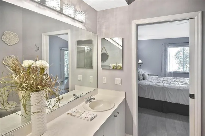 Bathroom featuring ensuite bath and vanity