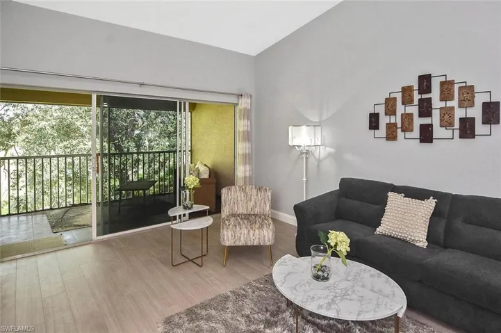 Living room with wood finished floors and baseboards