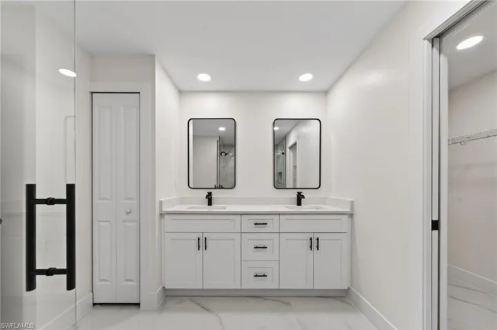 Double vanity with quartz-finish countertop and undermount sinks