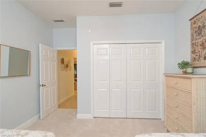 Dresser and closet in double bedroom