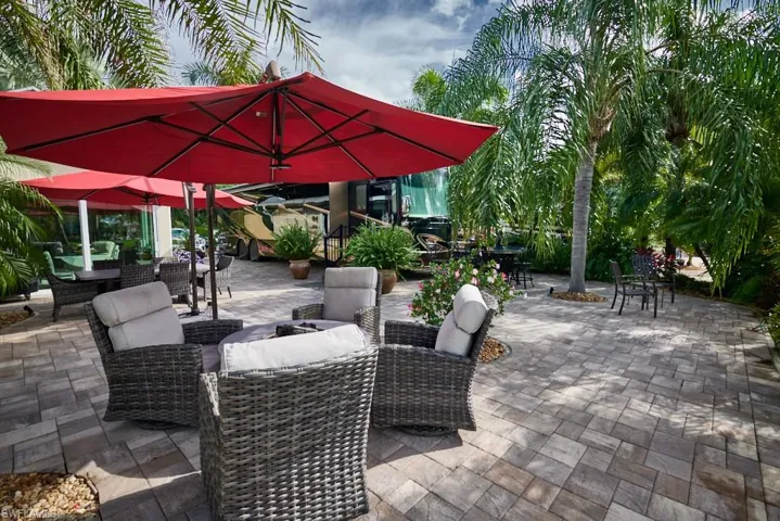 View of patio featuring a water view and outdoor lounge area