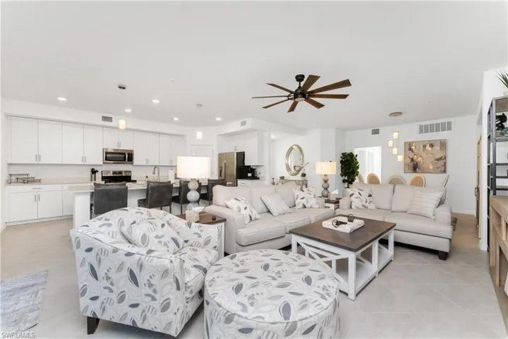 Living area featuring ceiling fan, recessed lighting, and light tile patterned floors