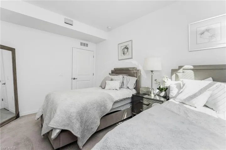 Carpeted bedroom with baseboards