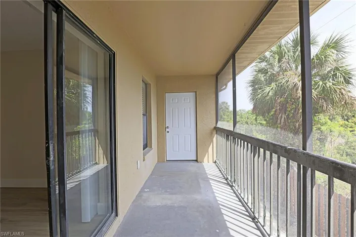 Balcony featuring a sunroom