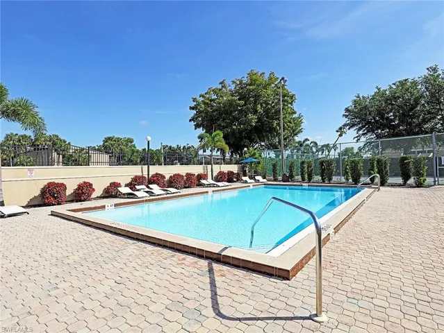 Community pool with a patio
