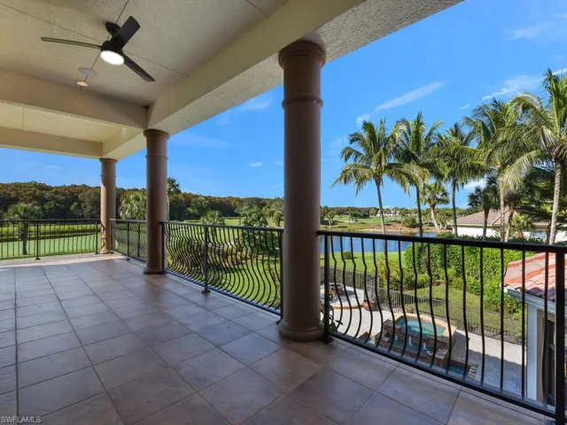 Balcony with ceiling fan and a water view