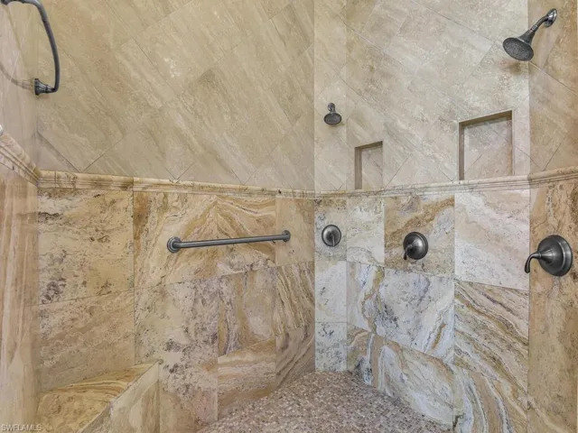 Bathroom view of a tile shower
