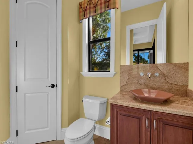 Bathroom featuring vanity and baseboards