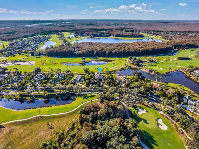 Aerial overview of property's location with a golf club, a large body of water, and nearby suburban area