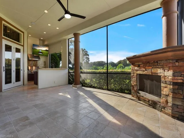 Unfurnished sunroom featuring healthy amount of natural light and french doors