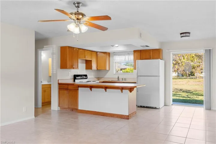 Open floor plan with slider leading to backyard