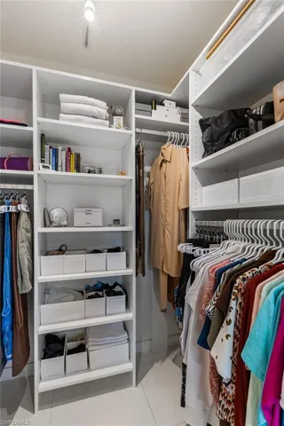 Primary closet is custom designed.