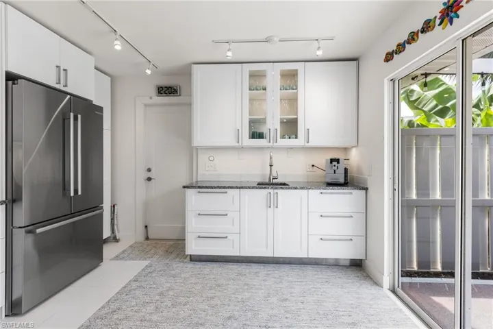 You have access to your screened in from your kitchen.