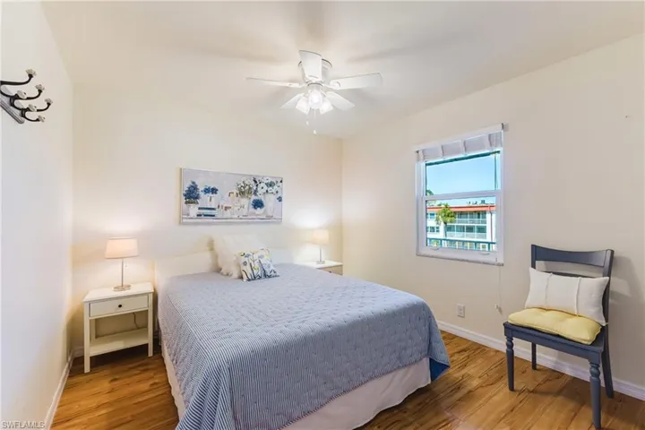 Bedroom featuring wood finished floors and a ceiling fan