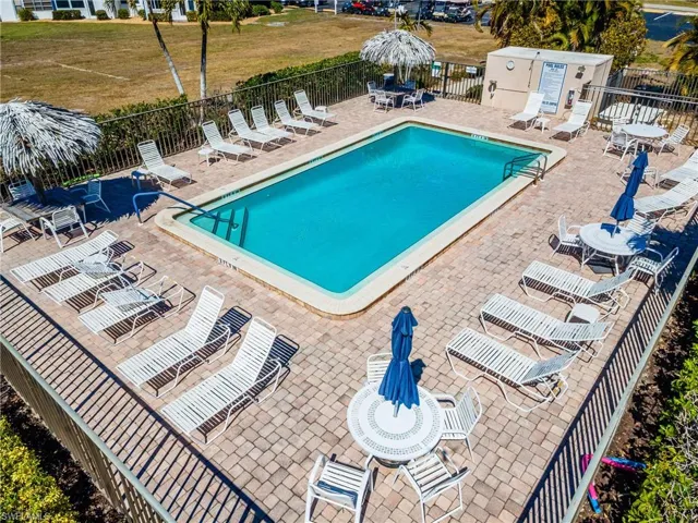 Community pool featuring outdoor dining area and a patio area