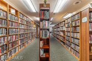 Miscellaneous room featuring bookshelves