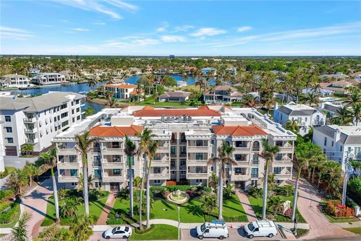 Birds eye view of property with a water view