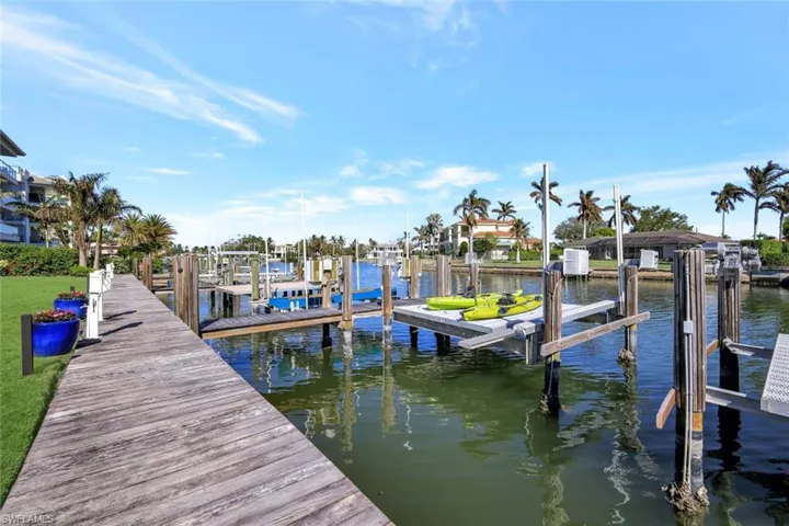 Dock area featuring a water view