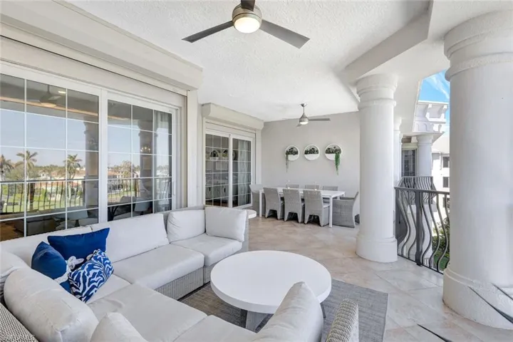 View of patio with outdoor lounge area and ceiling fan