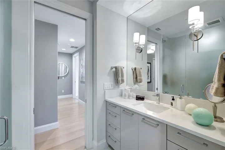 Bathroom with vanity and hardwood / wood-style flooring