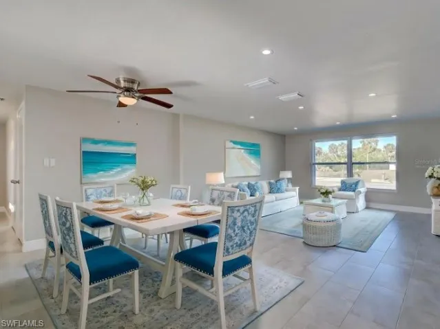 Dining room with ceiling fan and recessed lighting