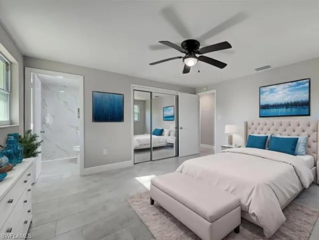 Bedroom featuring a ceiling fan, a closet, and connected bathroom