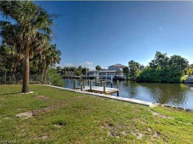 Dock with a water view and boat lift