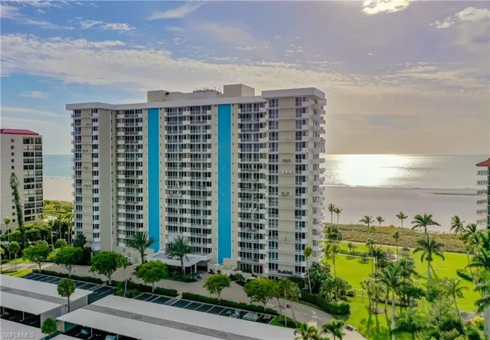 View of apartment building / complex featuring a water view