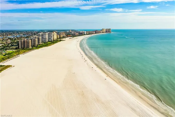 Aerial view of waterfront with a beach