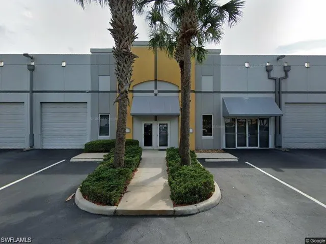 View of building exterior with a garage