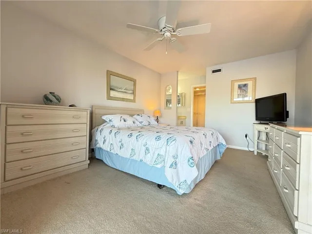 Master Bedroom featuring light carpet and ceiling fan