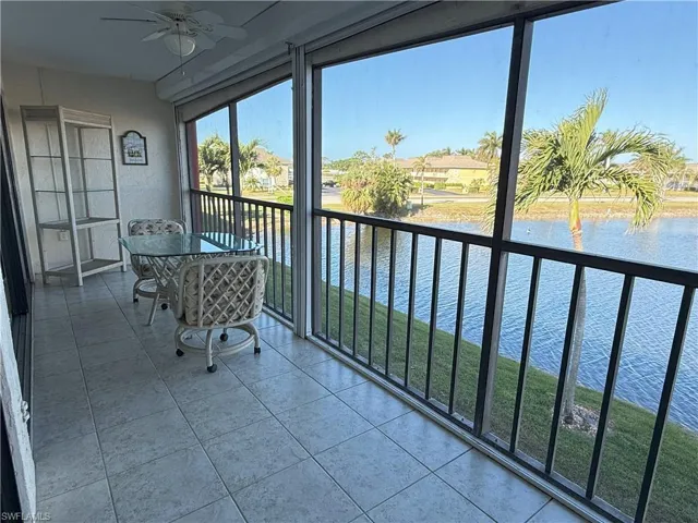 Extra Large Screened in lanai featuring a water view and ceiling fan