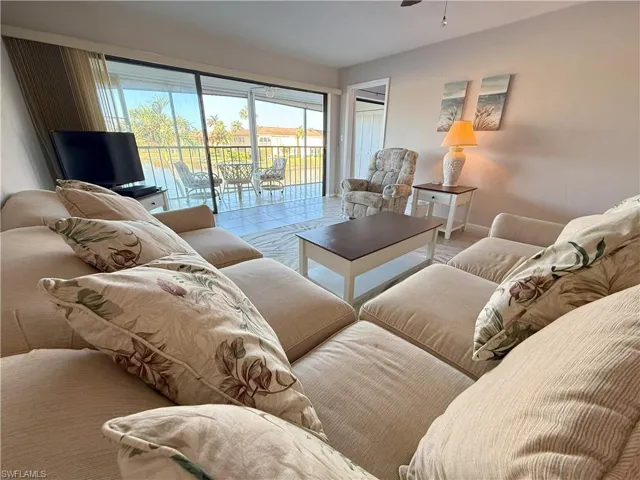 Living room featuring ceiling fan
