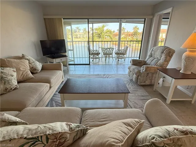 Living room with light tile patterned floors
