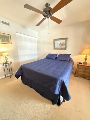 2nd Bedroom featuring light carpet, a closet, and ceiling fan