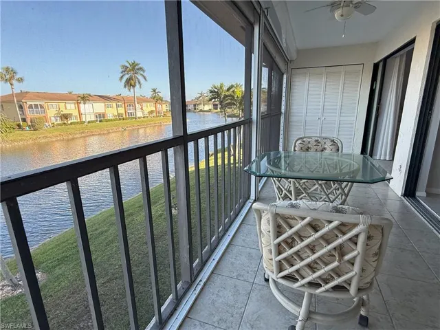 Extra Large Screened in lanai featuring a water view and ceiling fan